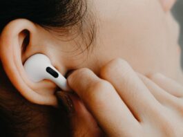 Close-up of woman using AirPods Pro 2