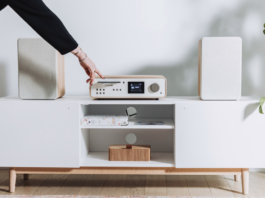 Pure Classic Stereo DAB+ radio on a hi-fi table in a white room